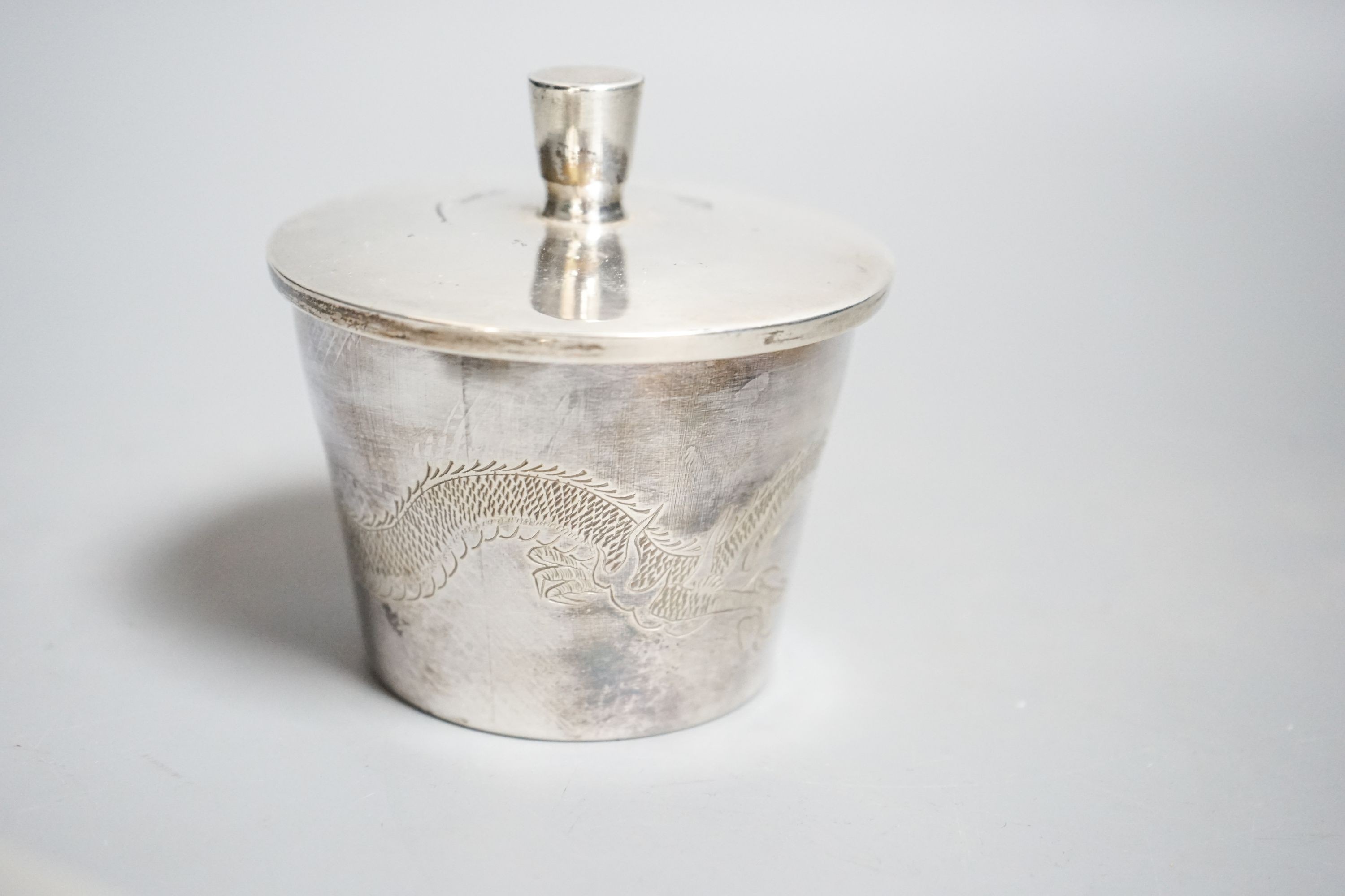A Chinese sterling pot and cover by Kingsburg, Hong Kong, 9.4cm, a similar cream jug and six napkin rings by Wang Hing